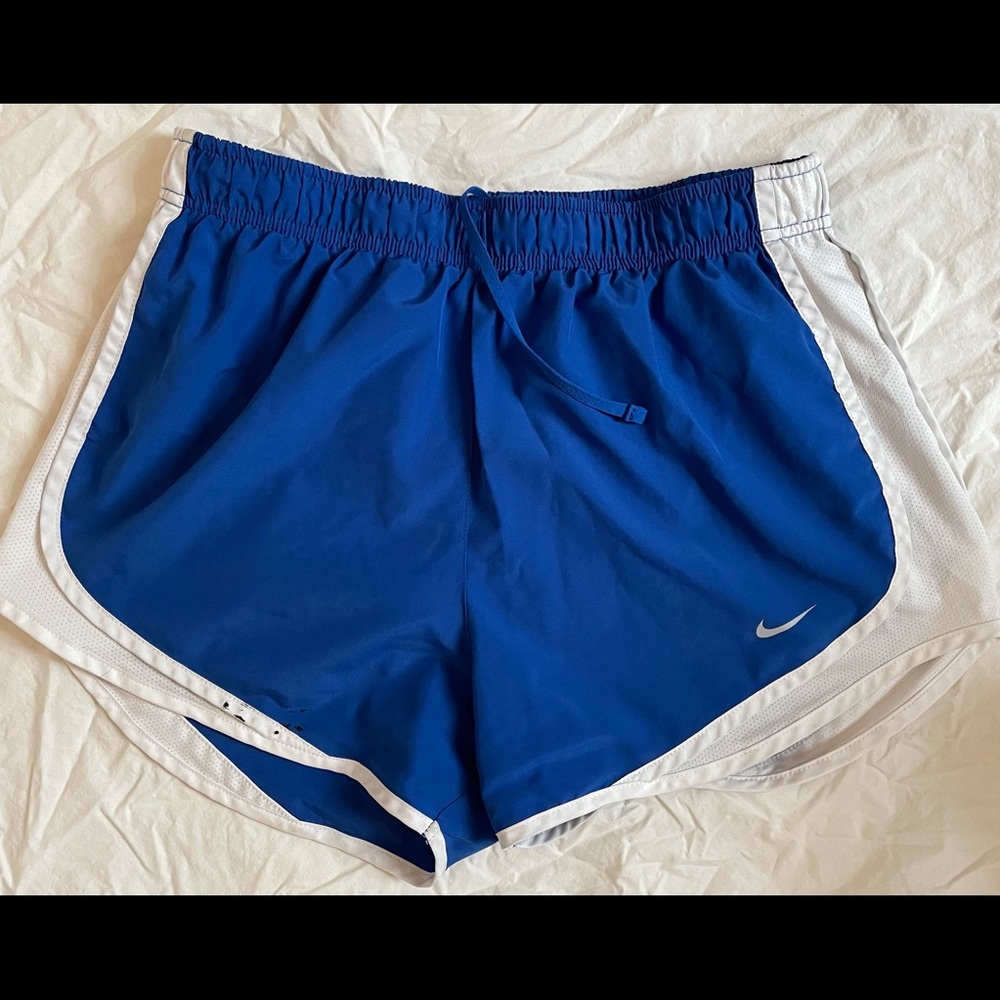 Blue Nike running shorts